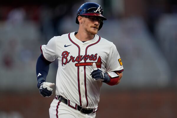 Braves catcher Sean Murphy runs the bases after his three-run homer.