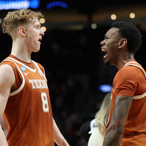 Texas center Matas Vokietaitis (8) celebrates with forward Nic Codie after the second round of the NCAA college basketball tournament against the Gonzaga, Saturday, March 21, 2026, in Portland, Ore.(AP Photo/Amanda Loman)