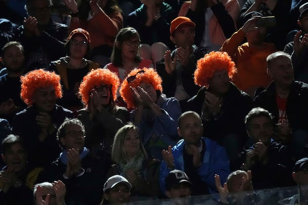 Jannik Sinner fans wait for the start of the semifinal tennis match against Tommy Paul, of the United States, at the Italian Open, in Rome, Friday, May 16, 2025. (AP Photo/Andrew Medichini)