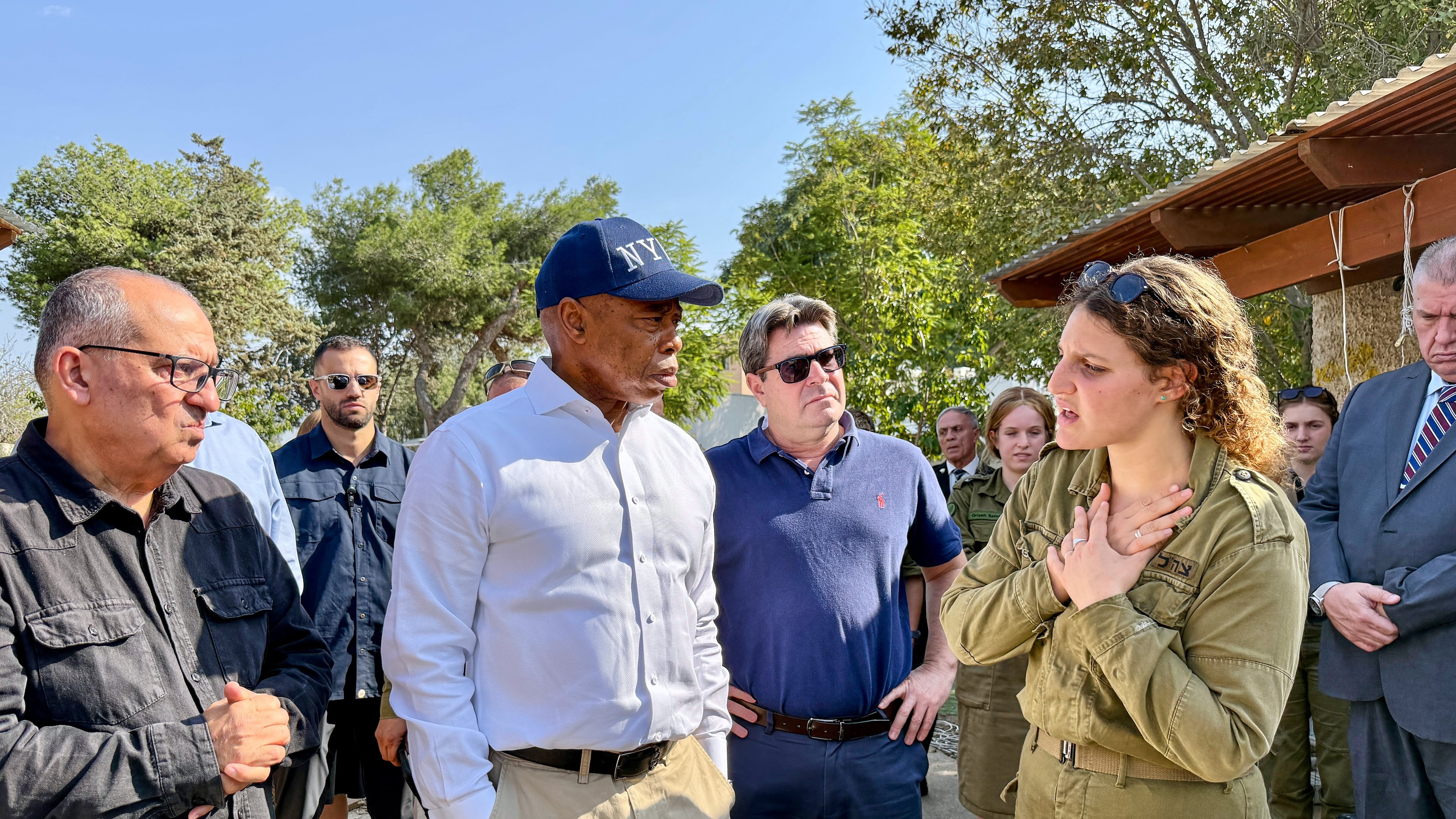 This image released by the Mayoral Photography Office shows New York Mayor Eric Adams, second left, during his visit to Kibbutz Kfar Aza, Nov. 18, 2025, which was attacked during the October 7th terrorist attacks on Israel. (Benny Polatseck/Mayoral Photography Office via AP)