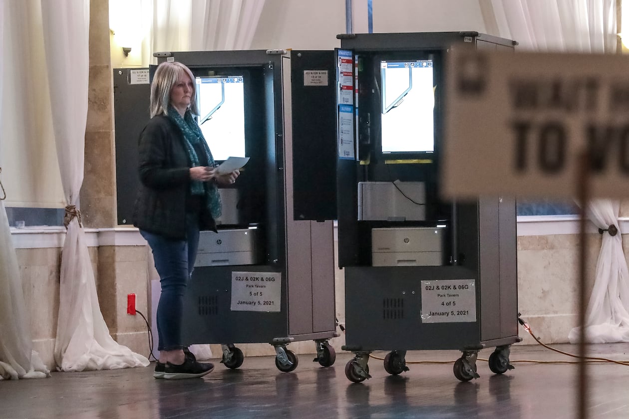 January 5, 2021 Atlanta: Voters lined up to cast ballots on Tuesday, Jan. 5, 2021 at the Park Tavern located at 500 10th St NE in Atlanta. Georgia’s long moment in the national spotlight culminated Tuesday, Jan. 5, 2021, when state voters cast their votes to determine which party would control the U.S. Senate. Georgia voters also voted to elect a member of the state Public Service Commission, which regulates energy and utility rates and issues. The two most expensive Senate races in history saw more than $833 million been spent by the four campaigns and outside groups supporting them, blanketing the airwaves and stuffing mailboxes across the state. Much of that money has come from organizations with no direct connection to Georgia. (John Spink / John.Spink@ajc.com)