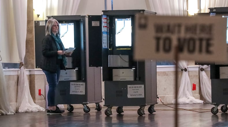 January 5, 2021 Atlanta: Voters lined up to cast ballots on Tuesday, Jan. 5, 2021 at the Park Tavern located at 500 10th St NE in Atlanta. Georgia’s long moment in the national spotlight culminated Tuesday, Jan. 5, 2021, when state voters cast their votes to determine which party would control the U.S. Senate. Georgia voters also voted to elect a member of the state Public Service Commission, which regulates energy and utility rates and issues. The two most expensive Senate races in history saw more than $833 million been spent by the four campaigns and outside groups supporting them, blanketing the airwaves and stuffing mailboxes across the state. Much of that money has come from organizations with no direct connection to Georgia. (John Spink / John.Spink@ajc.com)