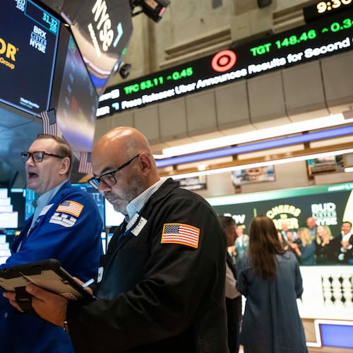 Trader Fred Demarco, right, and Specialist Patrick King, left, work on the floor of the New York Stock Exchange, Wednesday, Aug.. 5, 2026, in New York. (AP Photo/Yuki Iwamura)