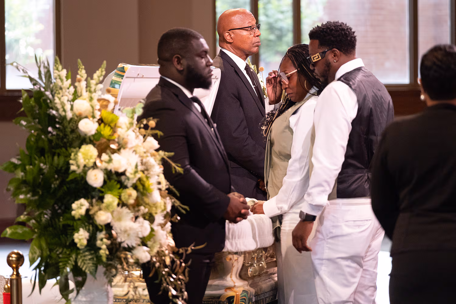 Tianah Robinson’s parents view her body at Ebenezer Baptist Church before the start of a celebration of life Saturday, April 18, 2026, in Atlanta. Robinson was the 16-year-old who was killed during a shooting at Piedmont Park following 404 Day celebrations. (Ben Gray for the AJC)