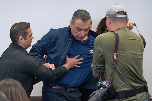 U.S. Sen. Alex Padilla, D-Calif., is pushed out of the room as Homeland Security Secretary Kristi Noem holds a news conference regarding the recent protests in Los Angeles, Thursday, June 12, 2025. (David Crane/The Orange County Register via AP)