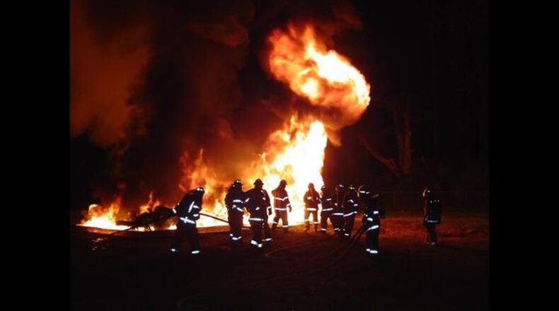 A house in the 1800 block of Macland Woods Drive in Powder Springs will be up in flames Wednesday.