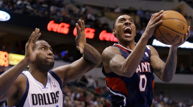 Atlanta Hawks guard Jeff Teague (0) drives to score past Dallas Mavericks forward Elton Brand (42) during the first half of an NBA basketball game, Monday, Feb. 11, 2013, in Dallas. (AP Photo/LM Otero)