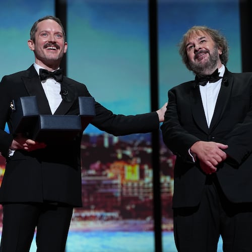 Elijah Wood, left, and director Peter Jackson, recipient of the honorary Palme d'Or, pose for photographers during the opening ceremony of the 79th international film festival, Cannes, southern France, Tuesday, May 12, 2026. (Photo by Scott A Garfitt/Invision/AP)