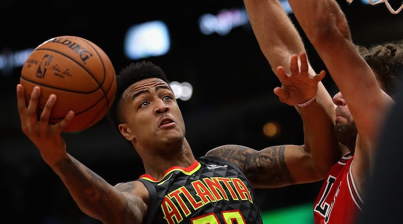 John Collins #20 of the Atlanta Hawks puts up a shot against Robin Lopez #42 of the Chicago Bulls at the United Center on October 26, 2017 in Chicago, Illinois. The Bulls defeated the Hawks 91-86.  (Photo by Jonathan Daniel/Getty Images)