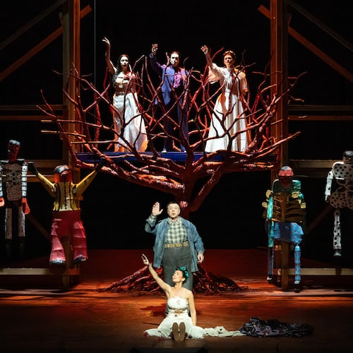This image released by the Metropolitan Opera shows mezzo-soprano Isabel Leonard as Frida Kalho, foreground center, and baritone Carlos Álvarez as Diego Rivera in a rehearsal for “El Último Sueño de Frida y Diego,” on May 11, 2026, at the Metropolitan Opera in New York. (Marty Sohl/MetOpera via AP)