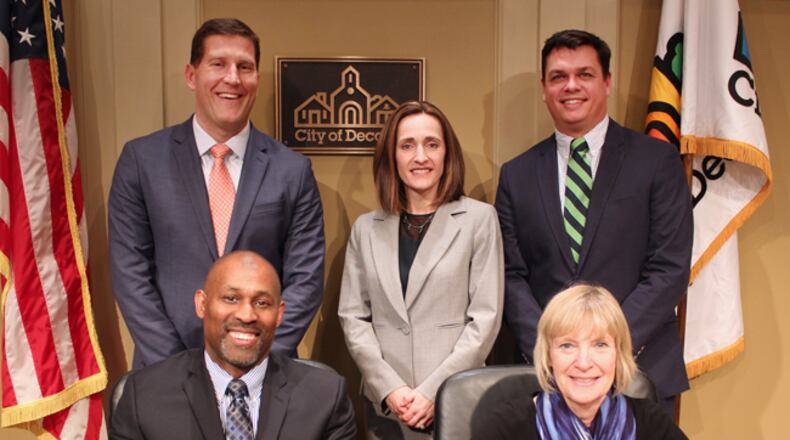 Tuesday’s Decatur commission meeting is cancelled for probably only the second time in five years. Commissioners standing left to right, Brian Smith, Kelly Walsh and Scott Drake while seated, Mayor Pro Tem Tony Powers and Mayor Patti Garrett. Courtesy City of Decatur