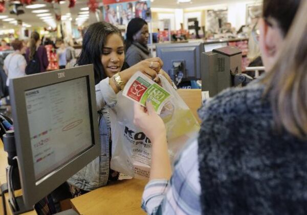 November 25, 2016 - East Cobb - Kieshonna Smothers checks out customers at Kohl's in East Cobb. Black Friday shoppers at Kohl's in East Cobb. Kohl's was among retailers opening Thursday evening and staying open until midnight Friday, nearly 30 hours later. BOB ANDRES /BANDRES@AJC.COM