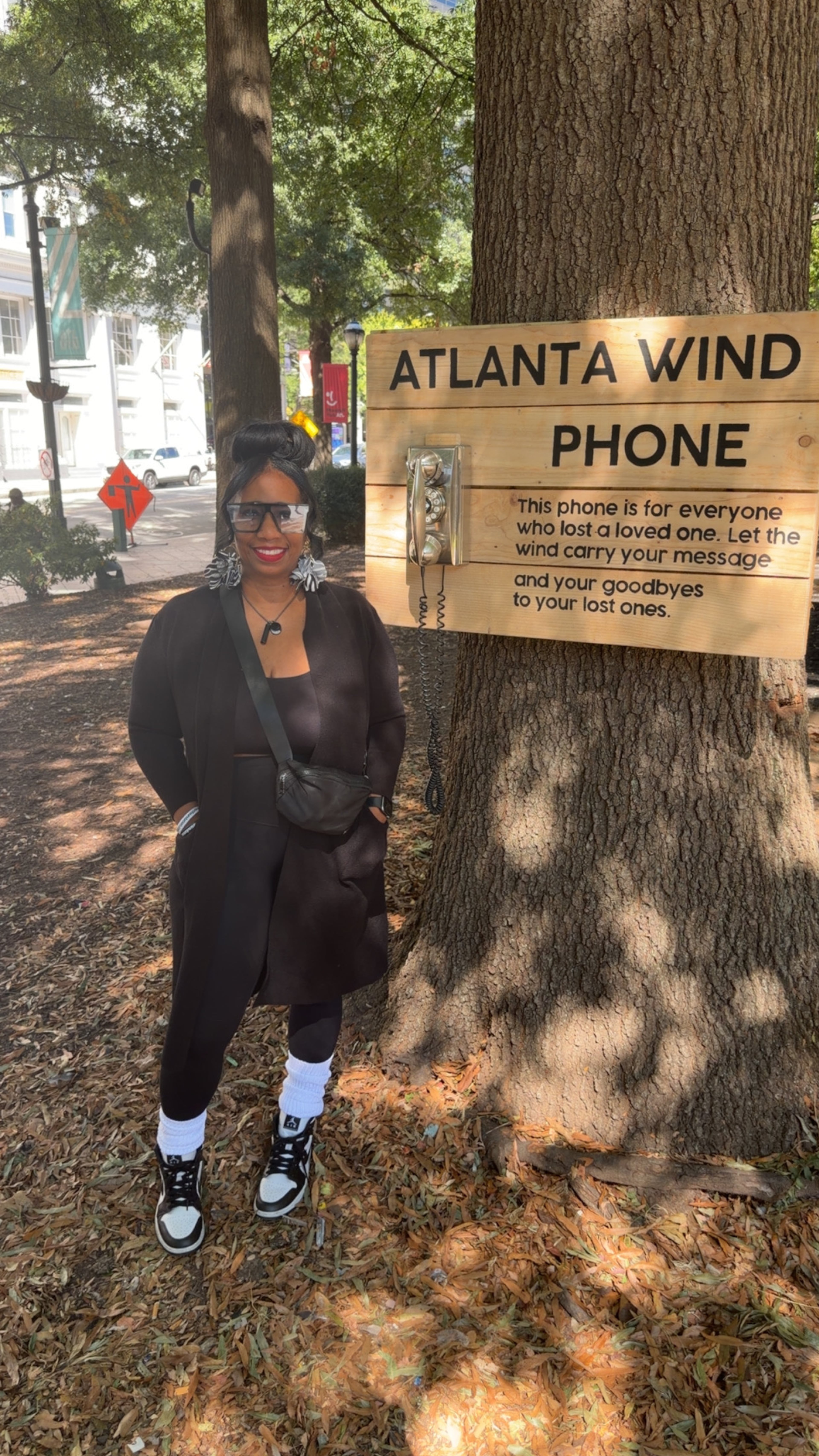 Pamela Elder visits the Grief House wind phone at Woodruff Park, which she recently found out about through friends on social media. (Courtesy of Pamela Elder)
