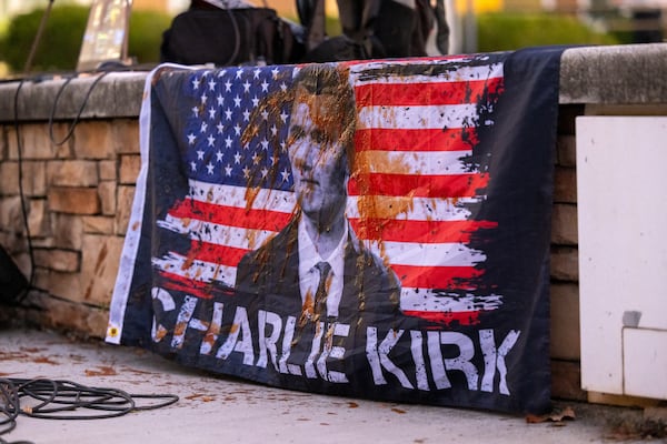 A flag is stained by ketchup after a protestor disrupts a memorial event for slain conservative activist Charlie Kirk at Kennesaw State University in Kennesaw on Tuesday, Oct. 14, 2025. (Arvin Temkar/AJC)