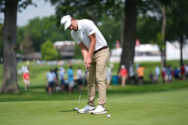Andrew Putnam hits a birdie putt on the eighth hole during the first round of the Rocket Classic golf tournament at the Detroit Golf Club, Thursday, June 26, 2025, in Detroit. (AP Photo/Paul Sancya)