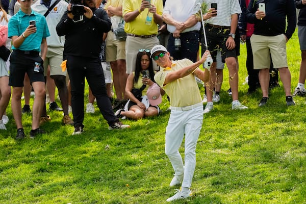 Rickie Fowler hits from the rough on the second hole during the final round of the Memorial golf tournament Sunday, June 1, 2025, in Dublin, Ohio. (AP Photo/Sue Ogrocki)