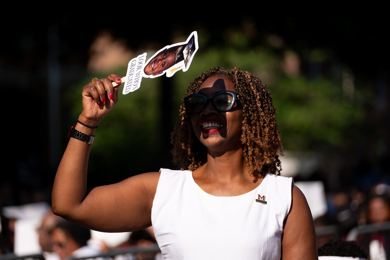 A person blocks the sun during the Morehouse College graduation Sunday, May 17, 2026. (Ben Gray for the AJC)