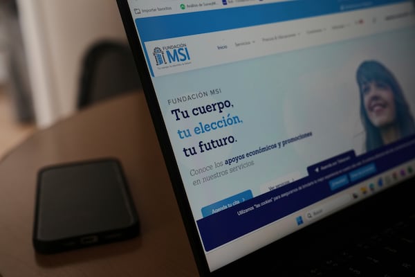 A computer monitor shows the splash page of the MSI Foundation website with a message that reads in Spanish: "Your body, your choice, your future", during a tour of the foundation, a non-governmental agency that offers information and help to women seeking abortions, in Mexico City, Thursday, May 8, 2025. (AP Photo/Marco Ugarte)
