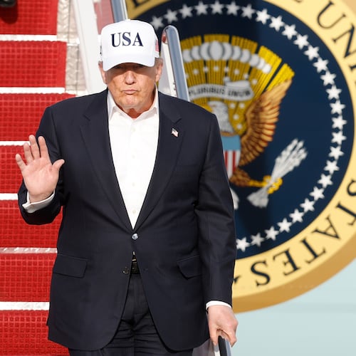 President Donald Trump walks down the stairs of Air Force One upon his arrival at Joint Base Andrews, Md., Friday, May 15, 2026. (AP Photo/Luis M. Alvarez)