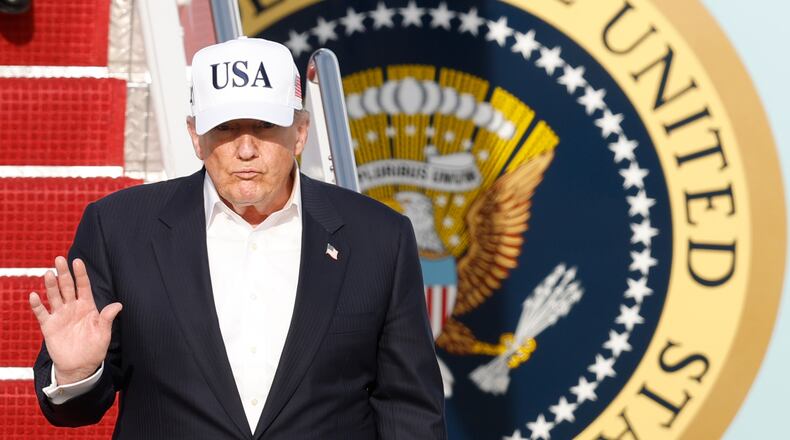 President Donald Trump walks down the stairs of Air Force One upon his arrival at Joint Base Andrews, Md., Friday, May 15, 2026. (AP Photo/Luis M. Alvarez)