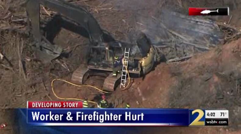 An excavator caught on fire in Palmetto on Tuesday morning, injuring a construction worker and firefighter.