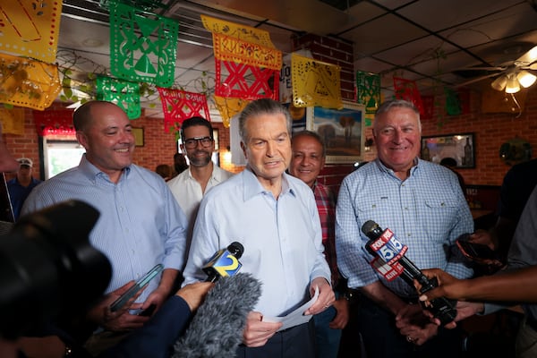 Republican nominee for governor Rick Jackson (center) speaks to members of the media during a campaign event at the Monterey Mexican Restaurant, Friday, June 26, 2026, in Doraville, Ga. This is Jackson’s first event after the Georgia Governor runoff. Also pictured is Georgia Attorney General Chris Carr (left) and Georgia insurance commissioner John King (right). (Jason Getz/AJC)