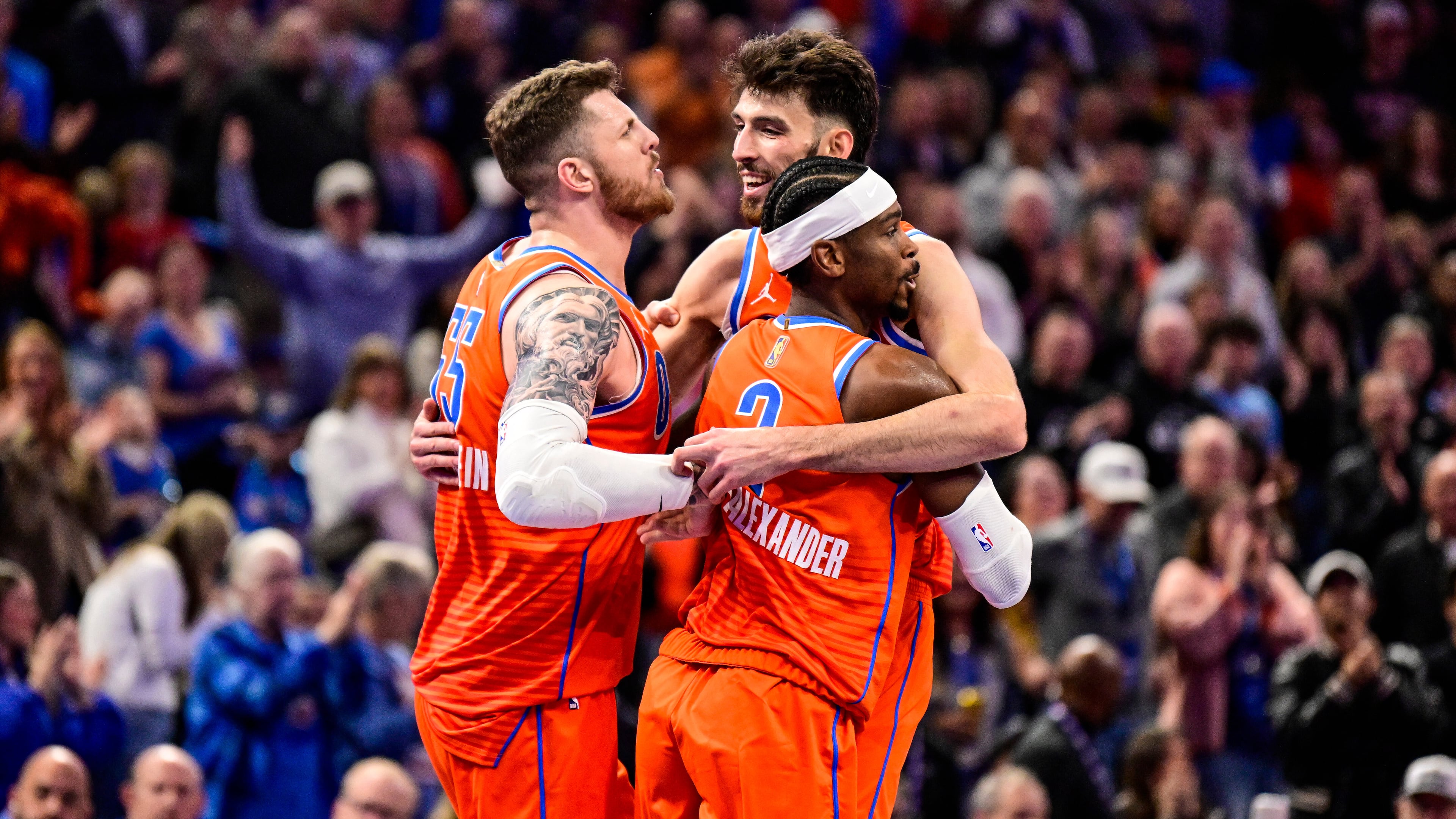 Oklahoma City Thunder center/forward Chet Holmgren (7), center, celebrates with Oklahoma City Thunder center/forward Isaiah Hartenstein (55) and Oklahoma City Thunder guard Shai Gilgeous-Alexander (2) during the second half of an Emirates NBA Cup basketball game, Wednesday, Nov. 26, 2025, in Oklahoma City. (AP Photo/Gerald Leong)