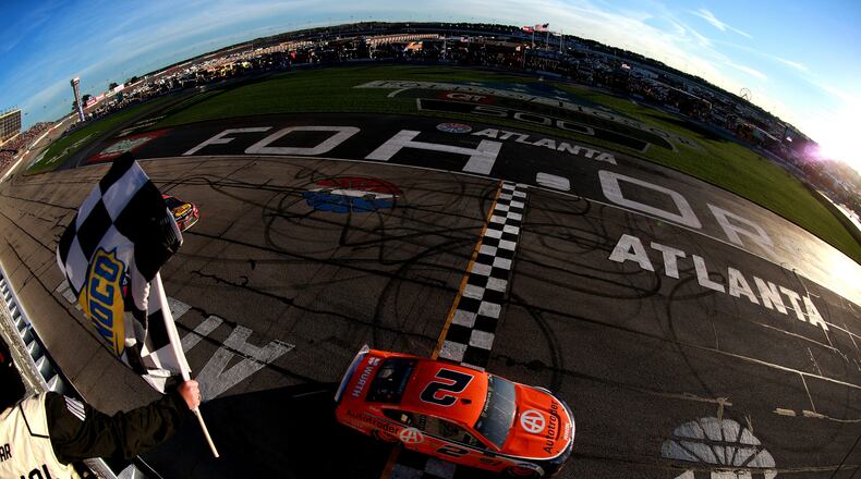 Brad Keselowski, driver of the #2 Autotrader Ford, crosses the finish line to win last year's Folds of Honor QuikTrip 500 at Atlanta Motor Speedway.  (Photo by Sean Gardner/Getty Images)