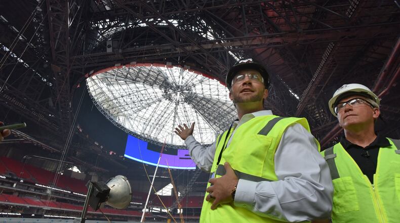 Tim Zulawski (left) is shown with Mercedes-Benz Stadium general manager Scott Jenkins while the stadium was still under construction.
