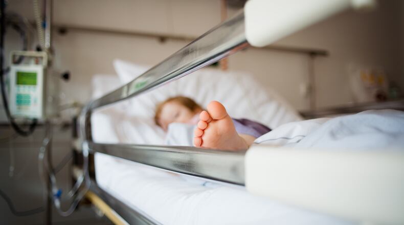 A child is lying in a hospital bed (file photo)