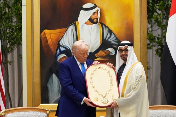 President Donald Trump is presented a medal from UAE President Mohammed bin Zayed Al Nahyan at Qasr Al Watan, Thursday, May 15, 2025, in Abu Dhabi, United Arab Emirates. (AP Photo/Alex Brandon)