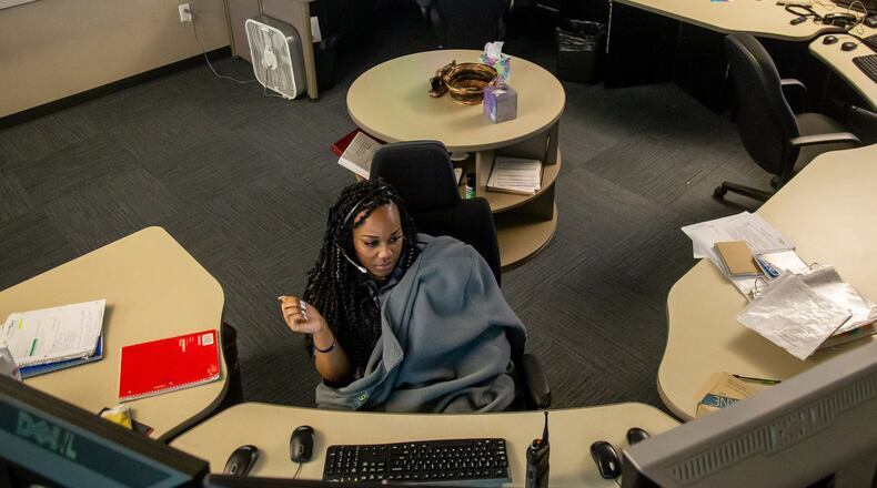 Operator Kelah Handley answers calls at Sandy Springs’ 911 dispatch center Wednesday, April 17, 2019. STEVE SCHAEFER / SPECIAL TO THE AJC