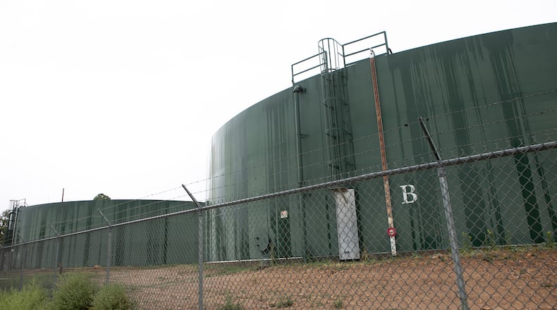 Reserve water tanks for holding drinking water for Grand Canyon Village stand behind fencing, Monday, Aug. 31, 2026, in Grand Canyon National Park, Ariz. (AP Photo/Josh Biggs)