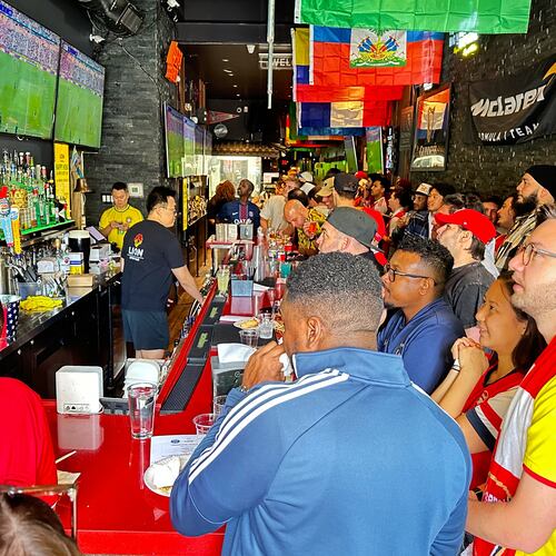 Fans watch a Champion league soccer match between Arsenal and Paris Saint-Germain at the Lion Sports Bar, Saturday, May 30, 2026, in Philadelphia. (AP Photo/Tassanee Vejpongsa)