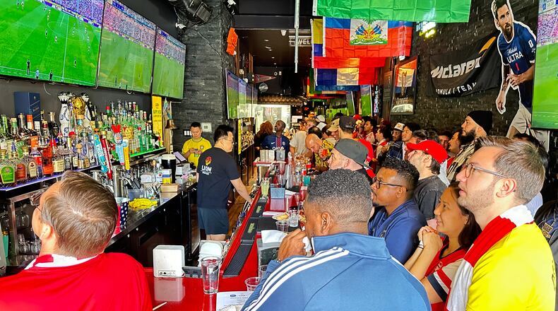 Fans watch a Champion league soccer match between Arsenal and Paris Saint-Germain at the Lion Sports Bar, Saturday, May 30, 2026, in Philadelphia. (AP Photo/Tassanee Vejpongsa)