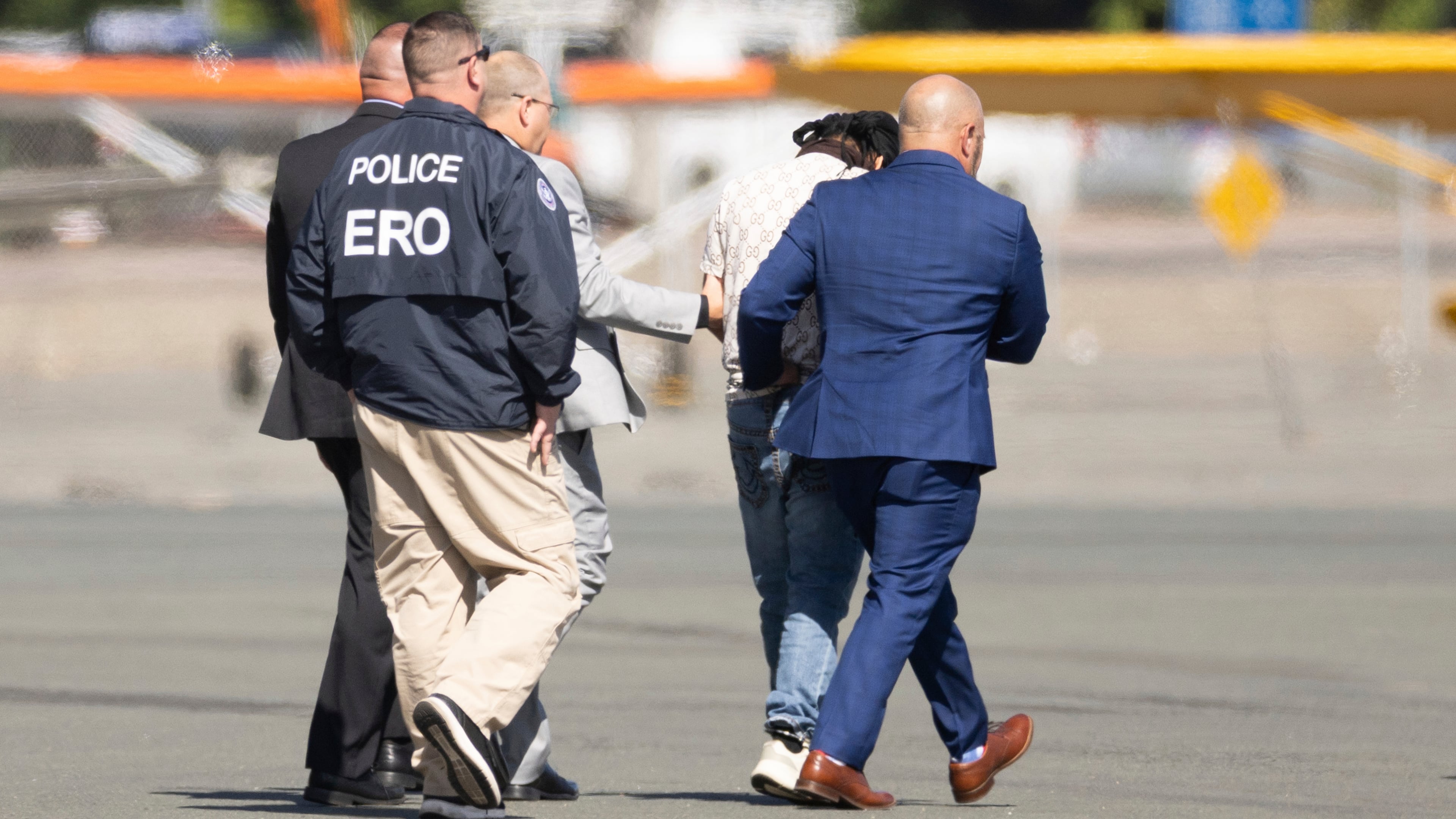 FILE - Harjinder Singh is escorted to an airplane by Florida Lt. Gov. Jay Collins and law enforcement, Aug. 21, 2025, in Stockton, Calif. (AP Photo/Benjamin Fanjoy, File)
