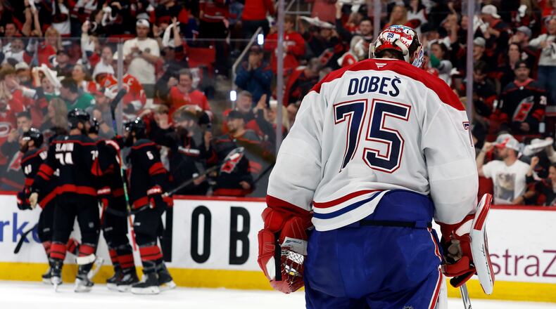 Carolina Hurricanes players celebrate after a goal by Nikolaj Ehlers as Montreal Canadiens goaltender Jakub Dobes (75) returns to the net during the second period in Game 2 of the Eastern Conference final NHL hockey Stanley Cup playoff series in Raleigh, N.C., Saturday, May 23, 2026. (AP Photo/Karl DeBlaker)