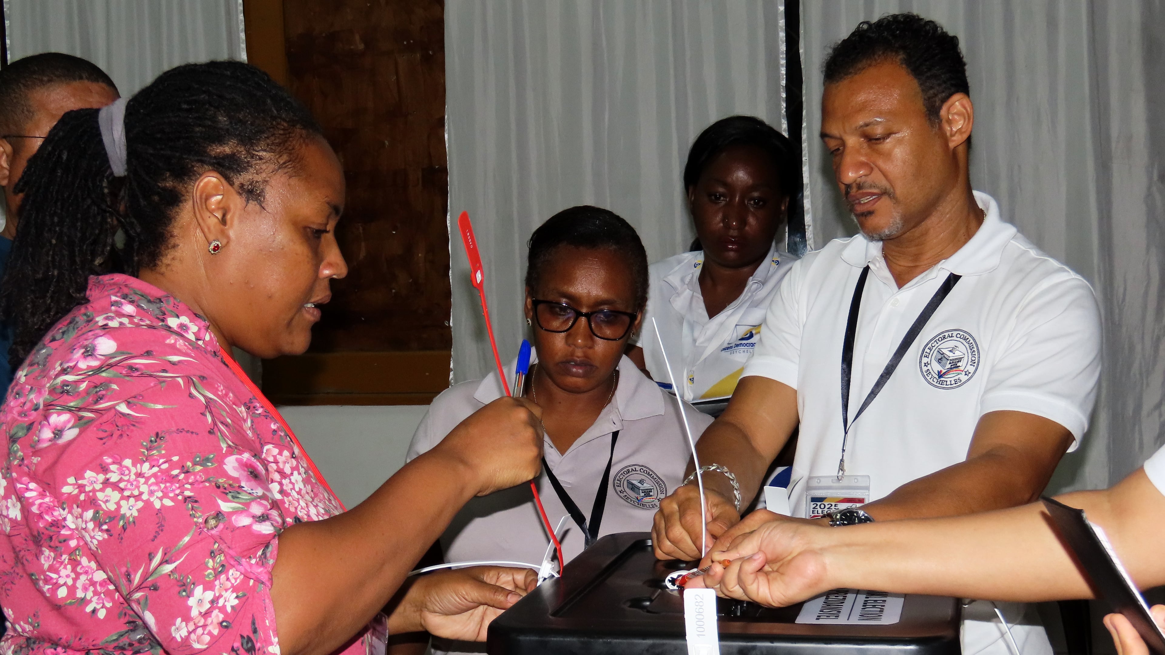 Election commission members count ballots after voting in a runoff presidential election at Mont Fleuri Secondary School polling station in Victoria, Seychelles, on Saturday, Oct. 11, 2025. (AP Photo/Emilie Chetty)