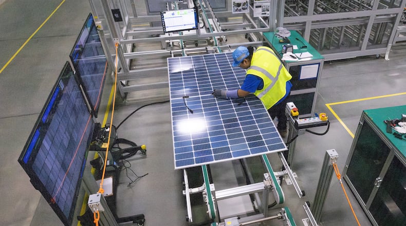 A worker at Qcells new manufacturing factory in Cartersville conducted quality performance checks on a freshly assembled solar panel on Tuesday, April 2, 2024.