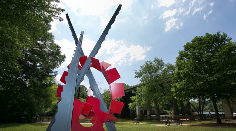 The sculpture, "Cycle," by Joey Manson is shown at Don White Park near the Highway 400 bridge in Roswell. The city seeks input from residents to rename the park.