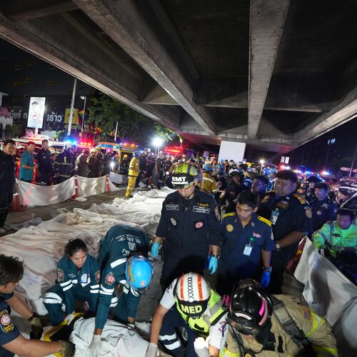 Bodies of victims of a fire are seen laid in a row in Bangkok, Thailand, Monday, July 13, 2026. (AP Photo/Sakchai Lalit)