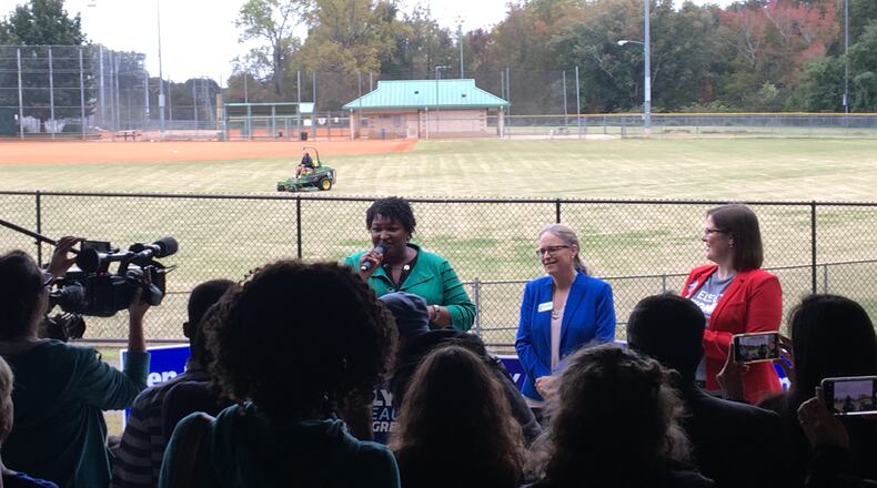 Stacey Abrams (left) and Carolyn Bourdeaux (center) rallied Democrats in Norcross on Thursday.
