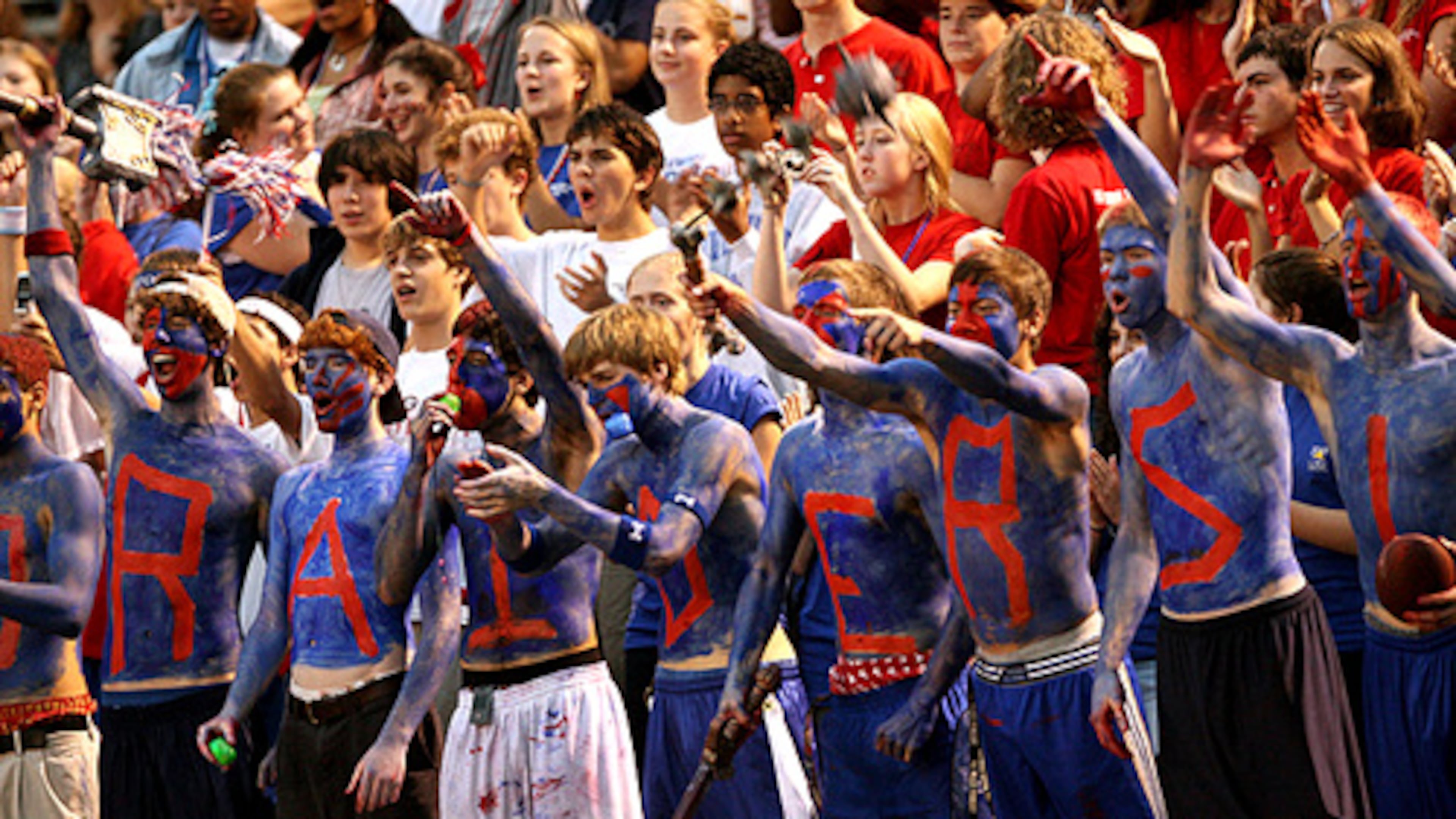 Riverwood students spell out "Raiders" in war paint while cheering for their team. The school has parted ways with football coach Shawn Cahill after a 5-25 run over three seasons.