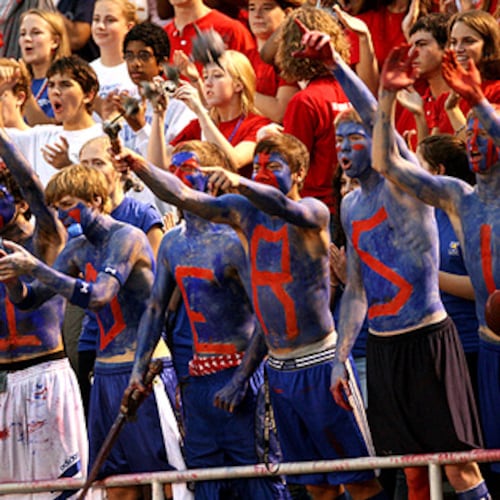 Riverwood students spell out "Raiders" in war paint while cheering for their team. The school has parted ways with football coach Shawn Cahill after a 5-25 run over three seasons.