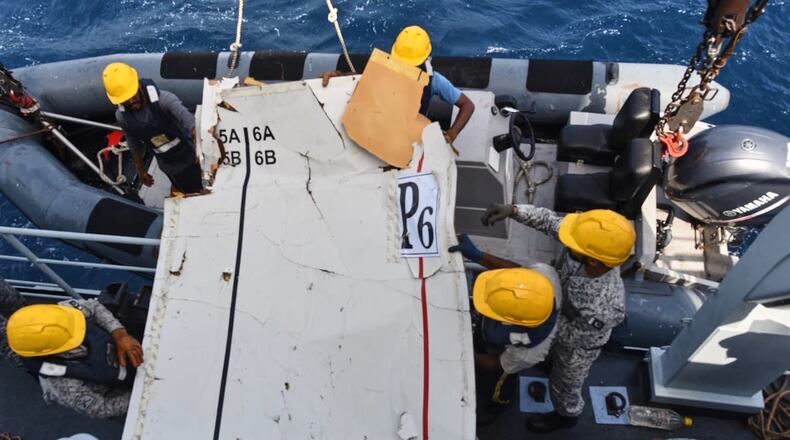 In this photo released by Pakistan Navy, Pakistan Navy personnel shift the wreckage of a cargo plane of the private carrier K2 Airways into a naval ship after recovering them from deep sea near Omara, a town some 360 kms. (220 miles) west of Karachi, Pakistan, Wednesday, July 8, 2026. (Pakistan Navy via AP)