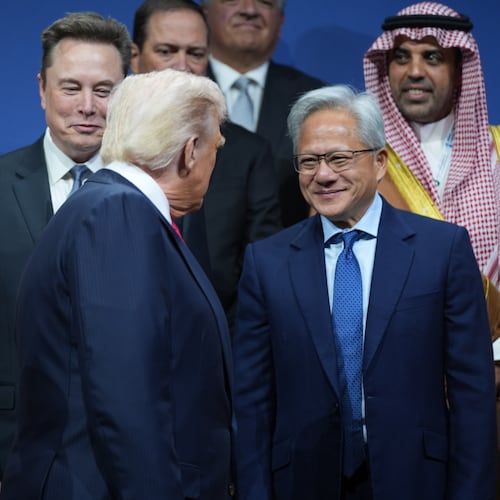 President Donald Trump speaks with Elon Musk and Nvidia CEO Jensen Huang, during the Saudi Investment Forum at the Kennedy Center, Wednesday, Nov. 19, 2025, in Washington. (AP Photo/Evan Vucci)