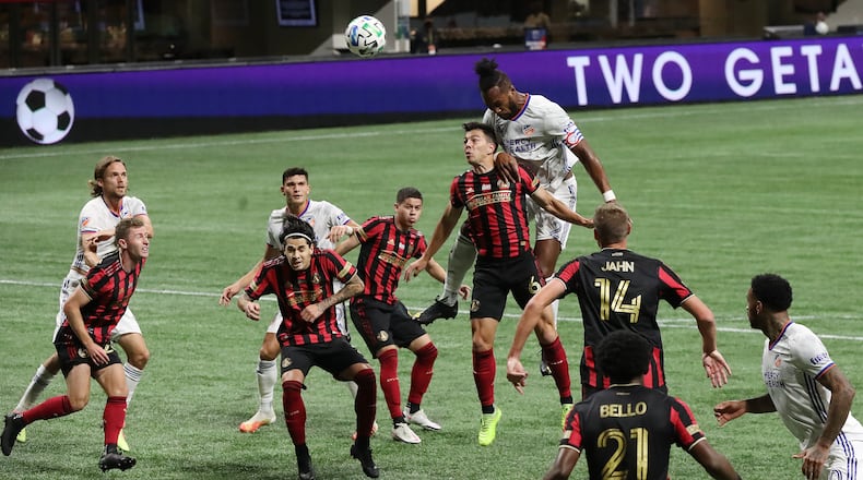 110120 Atlanta: Atlanta United defenders try to block a header by Cincinnati's Kendall Watson that goalkeeper Brad Guzan was able to save during their 2-0 victory Sunday, Nov. 1, 2020, at Mercedes-Benz Stadium in Atlanta. (Curtis Compton / Curtis.Compton@ajc.com)