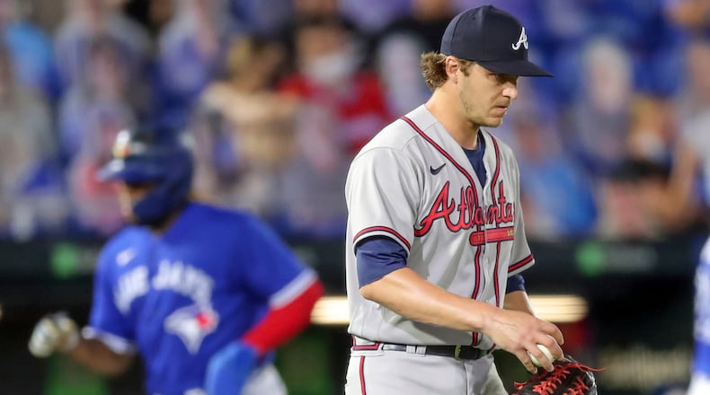 Atlanta Braves relief pitcher Jacob Webb reacts after giving up a three-run home run to Toronto Blue Jays' Teoscar Hernandez during the sixth inning of a baseball game Friday, April 30, 2021, in Dunedin, Fla. (AP Photo/Mike Carlson)