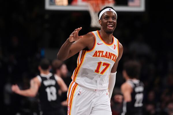 Atlanta Hawks' Onyeka Okongwu (17) gestures after making a three-point shot during the second half of an NBA basketball game against the Brooklyn Nets Thursday, April 10, 2025, in New York. (AP Photo/Frank Franklin II)
