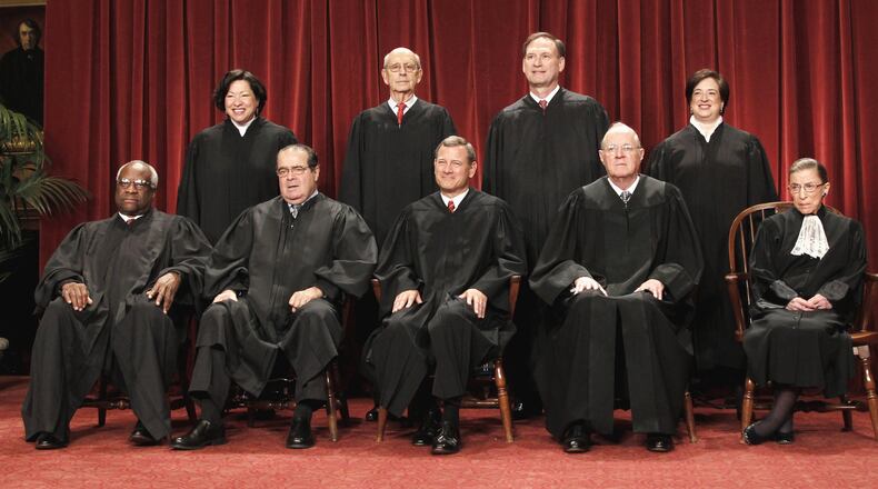 The nine justices of the U.S. Supreme Court. Seated from left: Associate Justices Clarence Thomas and Antonin Scalia, Chief Justice John Roberts, and Associate Justices Anthony M. Kennedy and Ruth Bader Ginsburg. Standing, from left: Associate Justices Sonia Sotomayor, Stephen Breyer, Samuel Alito Jr. and Elena Kagan. (AP Photo/Pablo Martinez Monsivais, File)